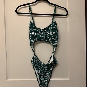Green and white one piece cut out swimsuit